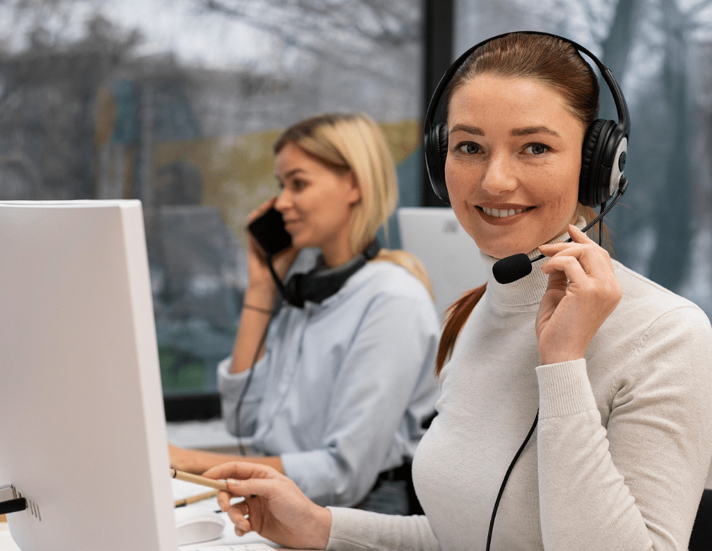 A woman smiling and wearing headphone, customer support